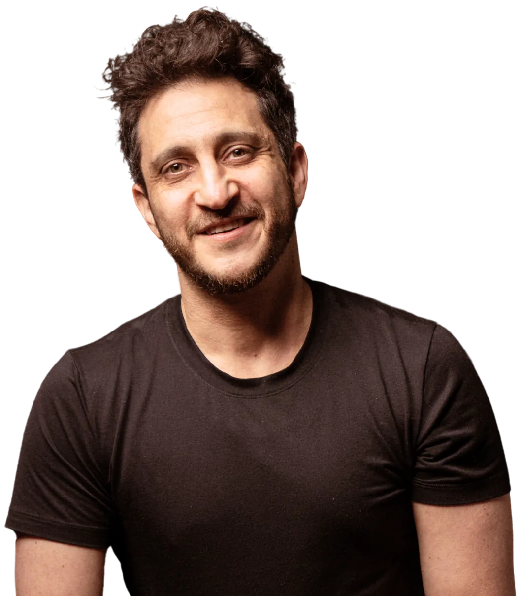 Jesse Elan smiling, in a black t-shirt